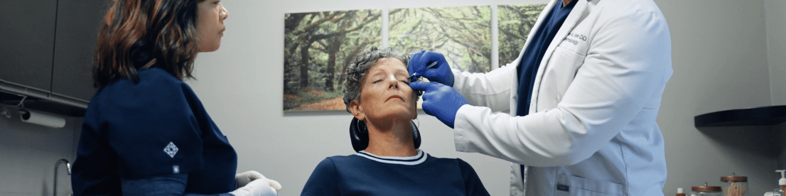 eye Doctor performing upper blepharoplasty on a patient at a clinic.