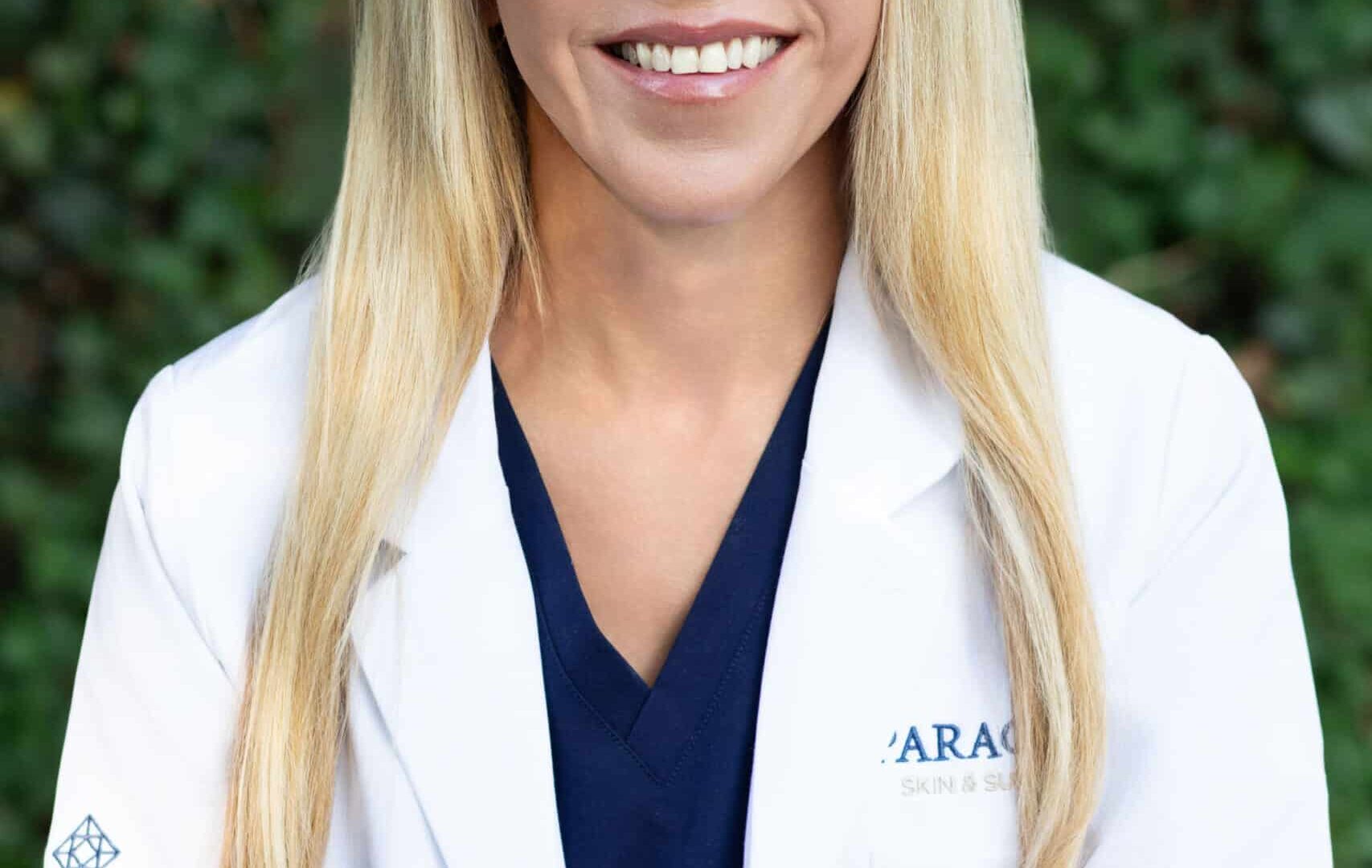 Healthcare professional in white coat at Paragon Skin & Surgery clinic.