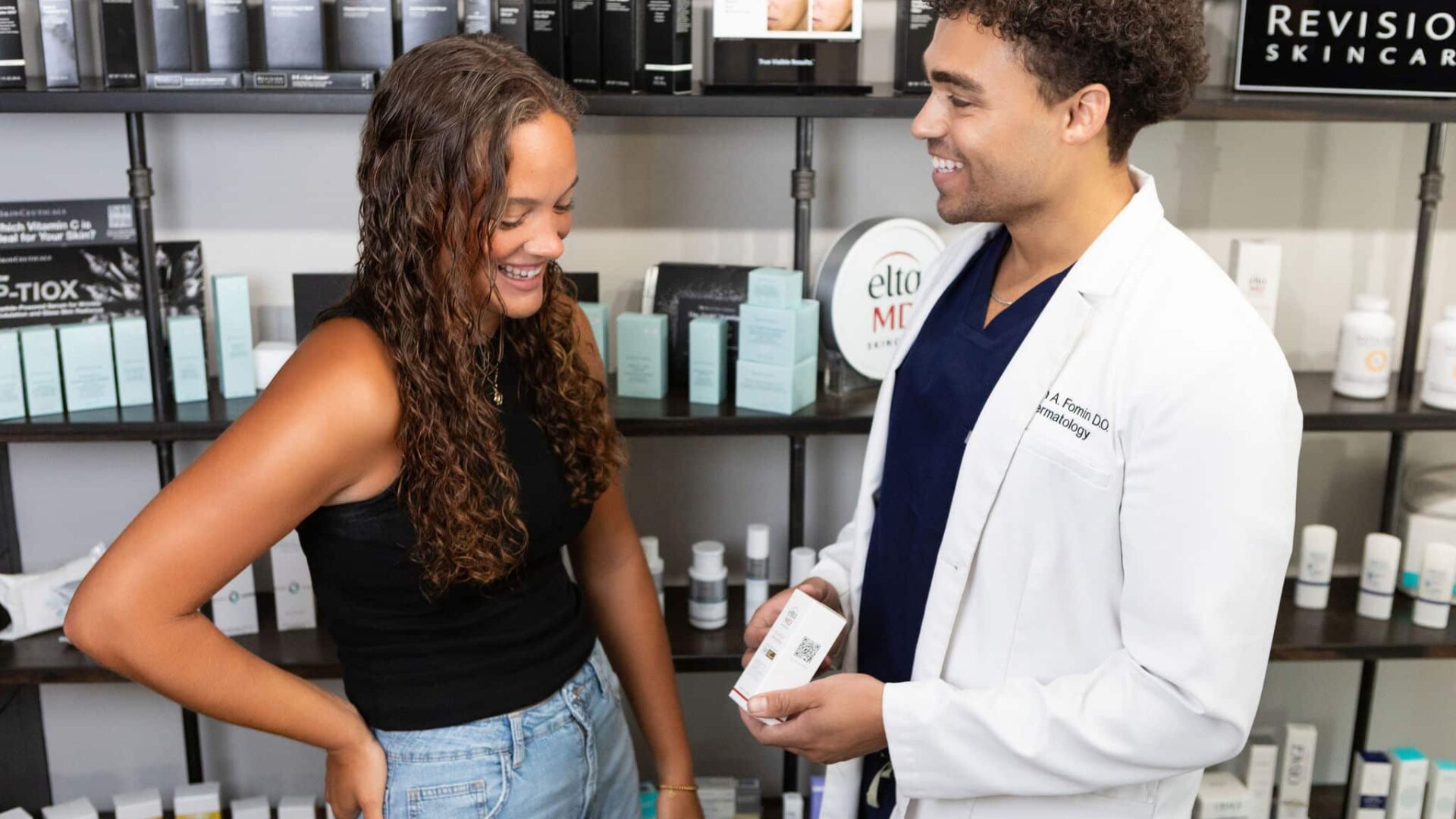 Dermatologist consulting with patient at Paragon Skin & Surgery clinic.