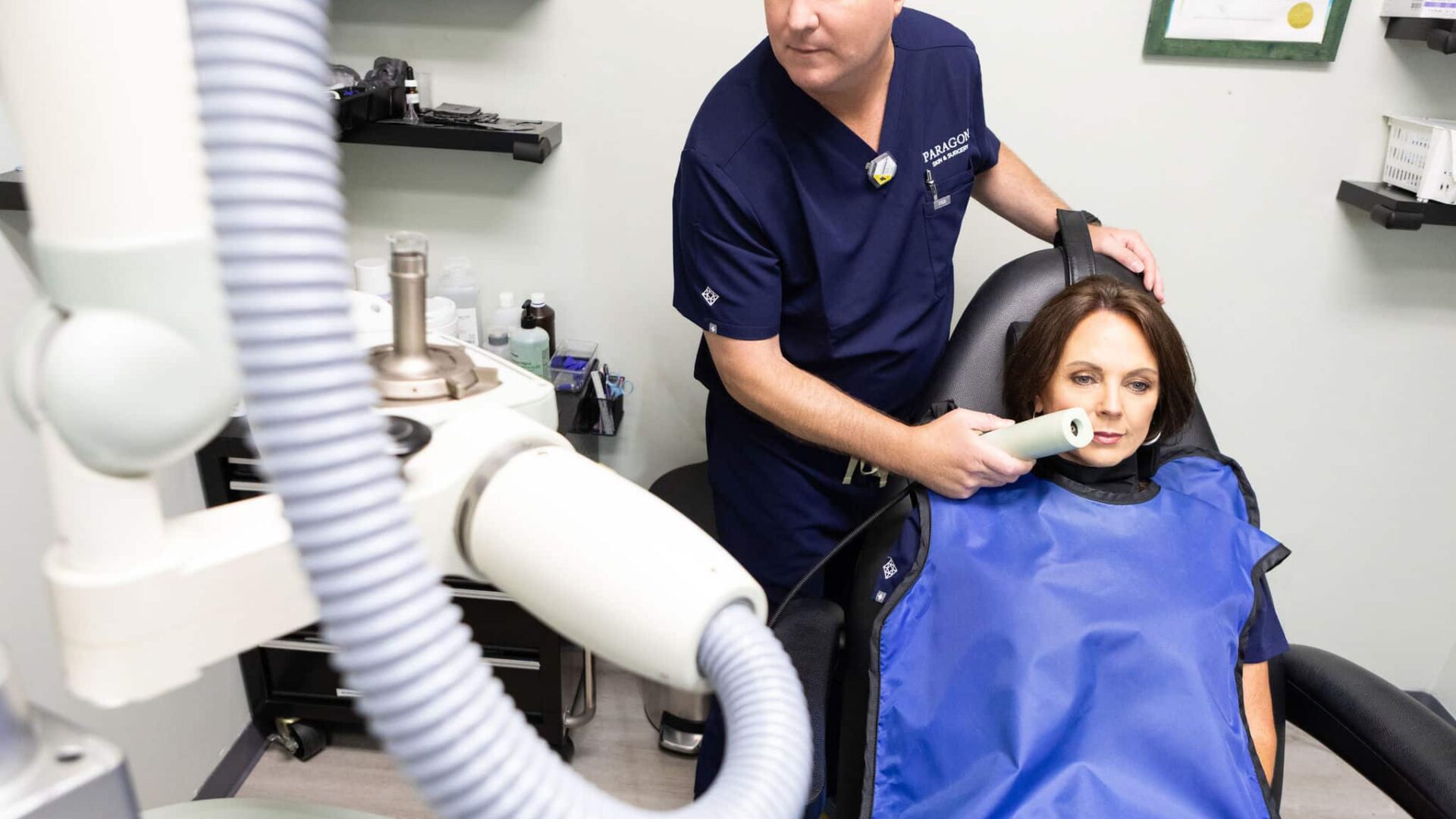 Dermatologist performing a skin examination on a patient in a clinic