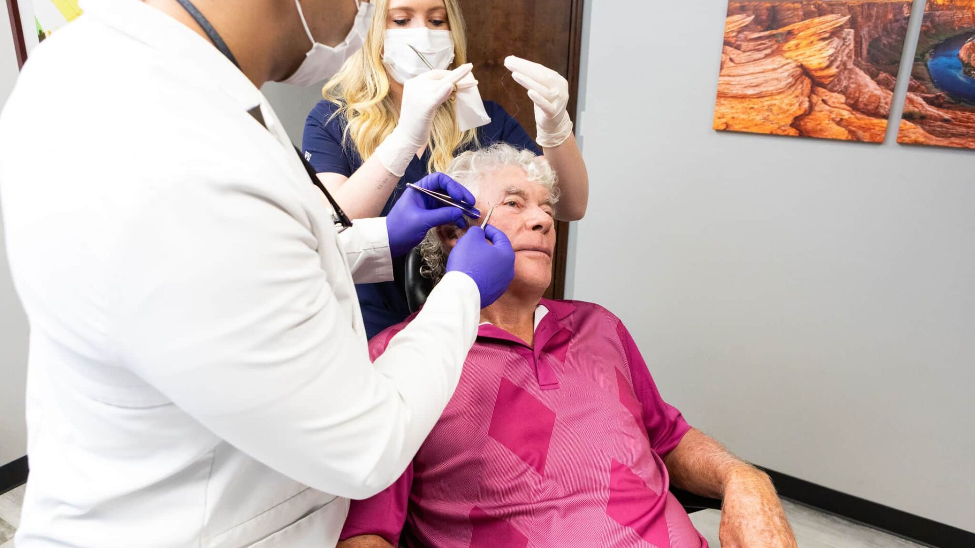 Doctor performing Mohs surgery on a patient's skin