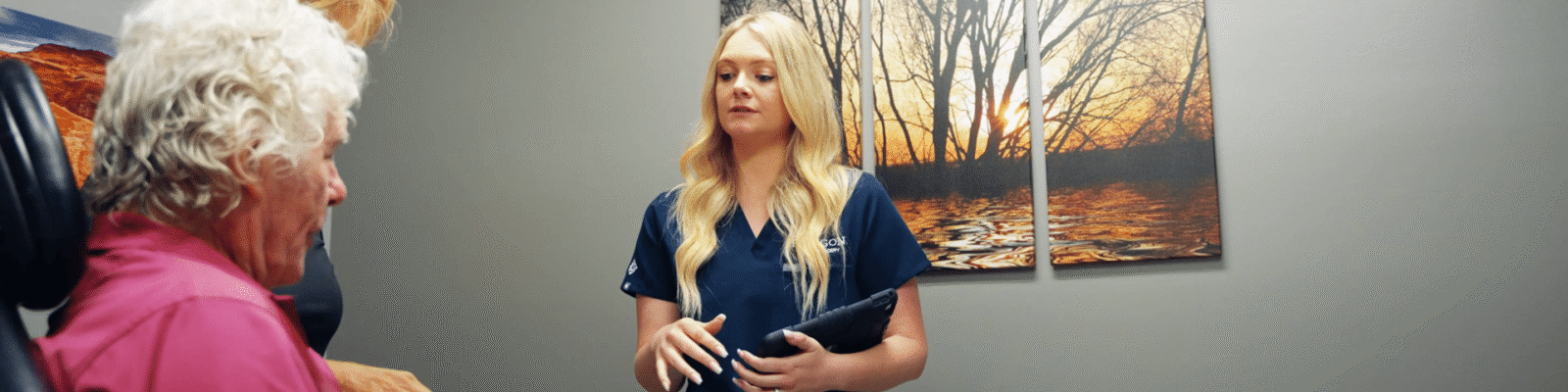 morning surgery Medical professionals discussing procedure with a patient in a clinic room.